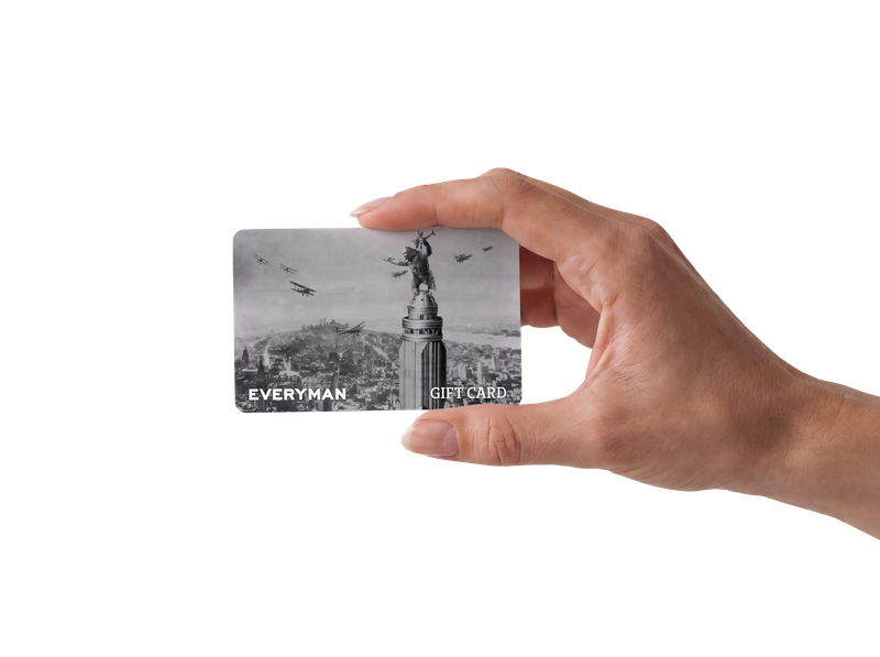 Hand holding an Everyman gift card
